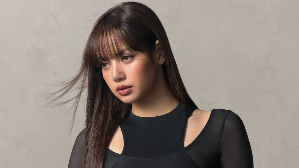 Lisa of BLACKPINK showcases her self-designed outfits on Instagram, featuring chic styles and announcing her new album release.