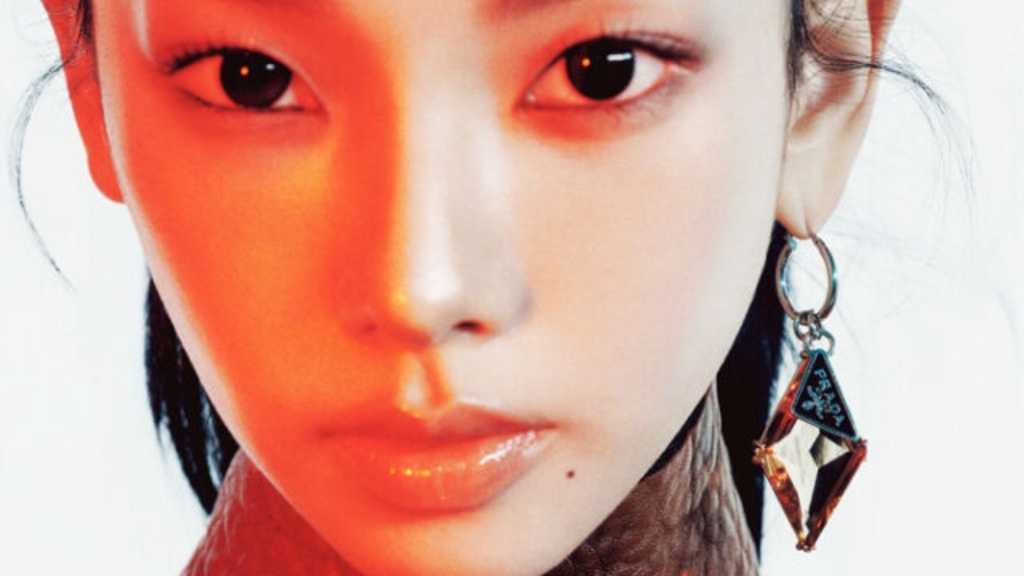 KARINA showcases her beauty in PRADA for DAZED KOREA, featuring a cover, interview, and a unique take on femininity and fashion.