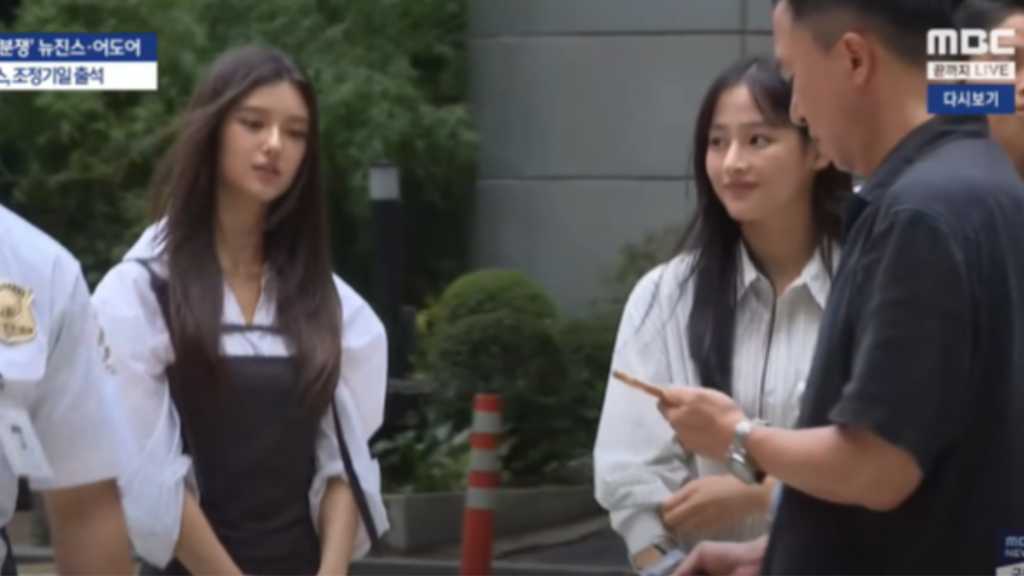 Mediation between ADOR and NewJeans continues, with members attending court. NewJeans claims contract termination; ADOR disputes it.