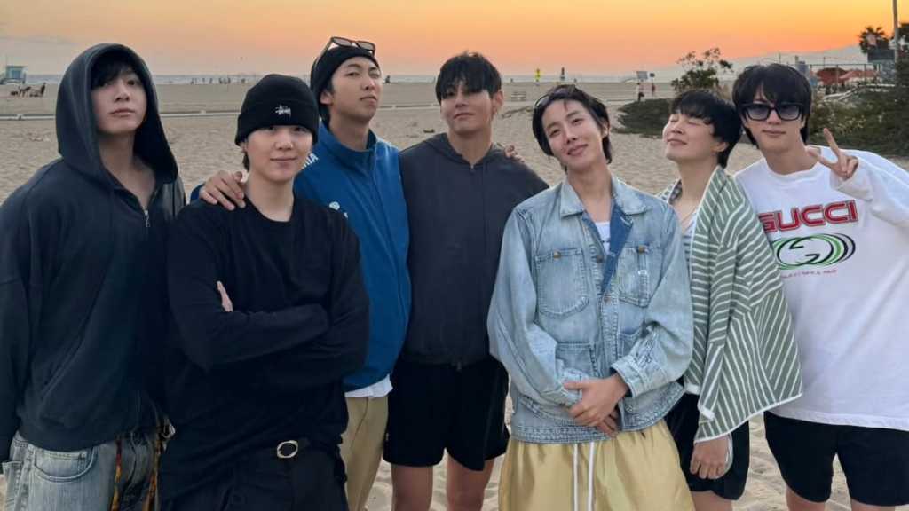 BTS released group photos from the U.S., showcasing their friendship and casual style, while teasing their upcoming album and world tour.