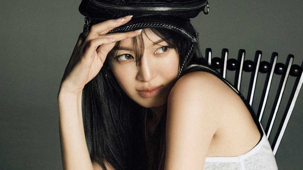 Girls' Generation's Hyoyeon shared bold Allure photos, showing a daring backless look and chic all-black styling.