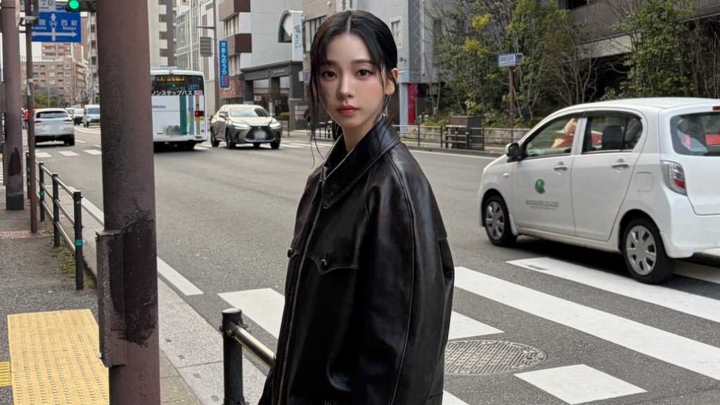 aespa's KARINA shares stunning photos from Japan, showcasing her chic fashion and beauty, garnering admiration from fans online.