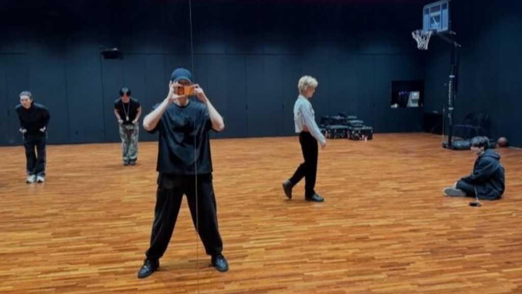 BTS builds excitement for their comeback with a new album, sharing practice photos that showcase their energy and unity as a group.