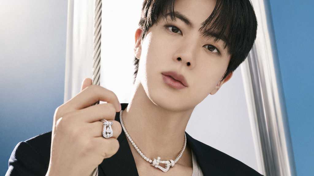 BTS's Jin stars in FRED's new campaign for the iconic 'Force 10' collection, showcasing bold elegance and inner strength.