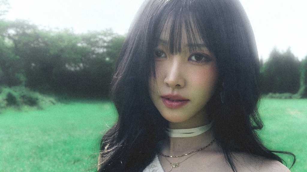 Yuju from GFRIEND teases her comeback with 'In Bloom,' showcasing deep visuals and unique charm in concept photos released on SNS.