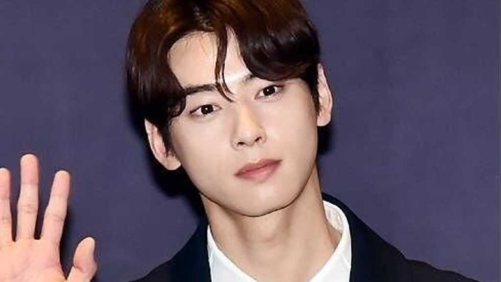 Cha Eun-woo of ASTRO shares updates from military service, posing with singer So Hyang at a Defense Ministry event, captivating fans.