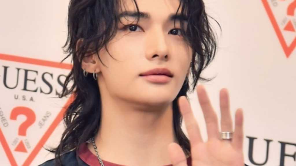 Hyunjin from Stray Kids attended the GUESS pop-up store opening in Seoul, showcasing his new visuals and sharing recent travel photos.