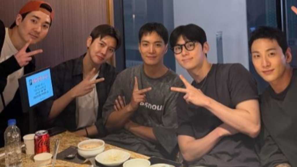NU'EST members share a group photo, showcasing their lasting friendship despite pursuing solo careers after their contract ended in 2022.