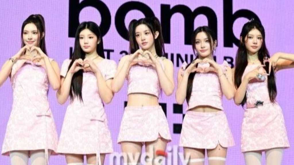 ILLIT teams up with US producers for their debut single 'NOT CUTE ANYMORE,' showcasing their unique charm and musical growth.