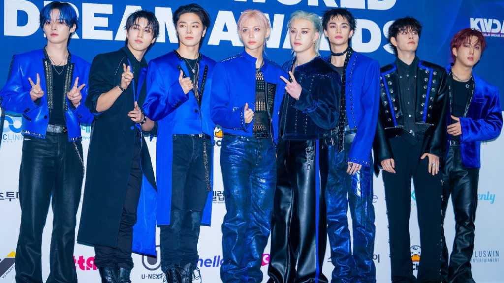 Stray Kids and other artists attended the K-WORLD DREAM AWARDS blue carpet event in Seoul, showcasing various performances and appearances.