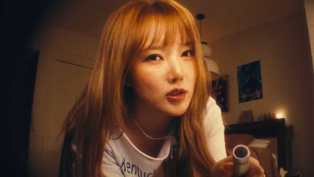 Yerin, former GFRIEND member, releases 'Awake', a rock-infused single, showcasing her growth and vibrant energy. Music video out now.