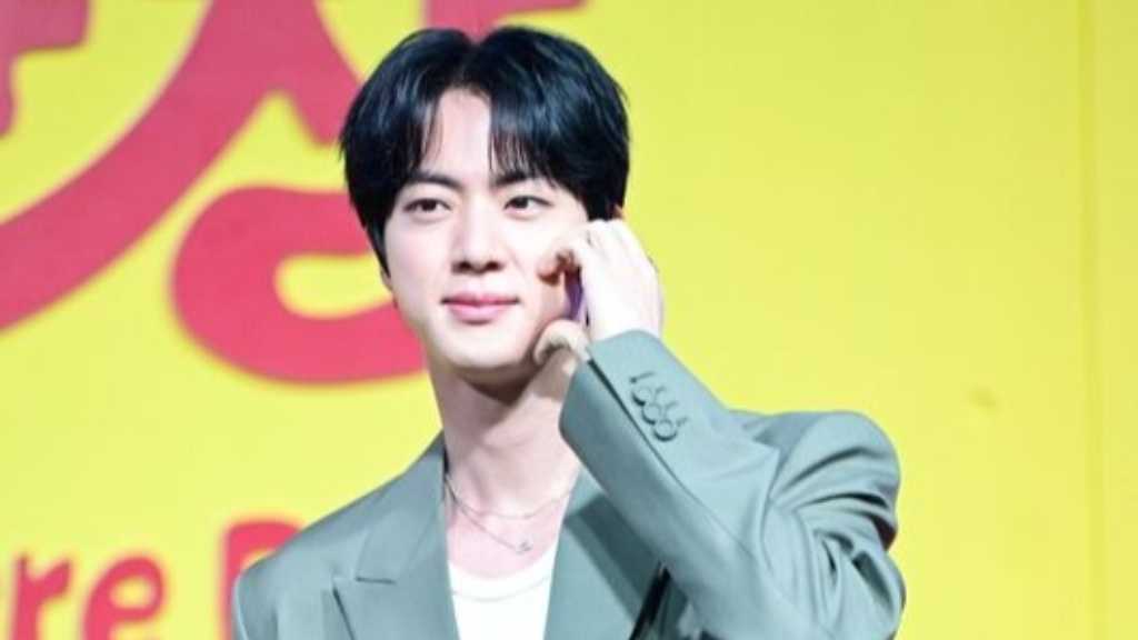 BTS's Jin reveals he missed album credits due to solo tour conflicts, joining the song camp late. Members express gratitude for his efforts.
