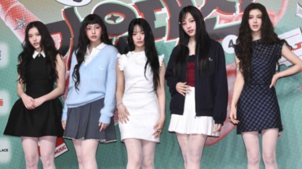 NewJeans fan group 'Team Bunnies' faces legal scrutiny for alleged violations of donation laws related to fundraising efforts.