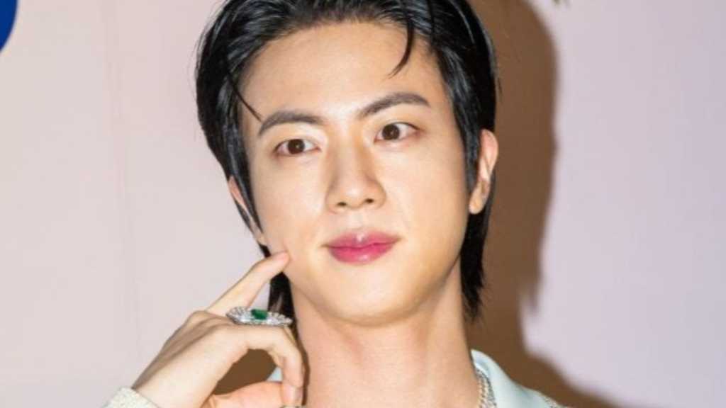Model Kim Myung-jin married a CEO in a lavish ceremony attended by stars, including BTS's Jin, with a stunning floral decor.