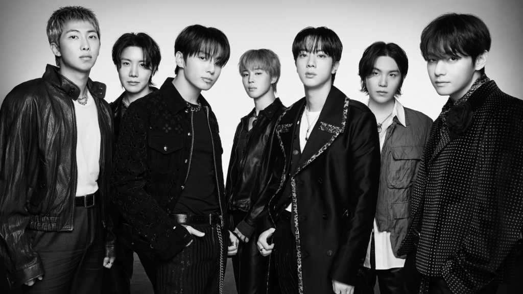 BTS's album 'ARIRANG' tops UK charts, with 'SWIM' hitting #2 on singles. They dominate global charts on Spotify and in Australia.