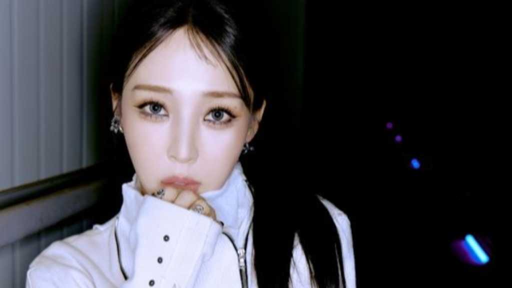 Moonbyul of MAMAMOO showcases new charm with her upcoming single 'REV', featuring a racing concept and vibrant visuals.