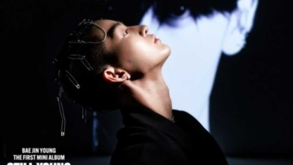 Be Jinyoung showcases striking visuals for his 1st mini album 'STILL YOUNG', highlighting his unique charm and artistic transformation.