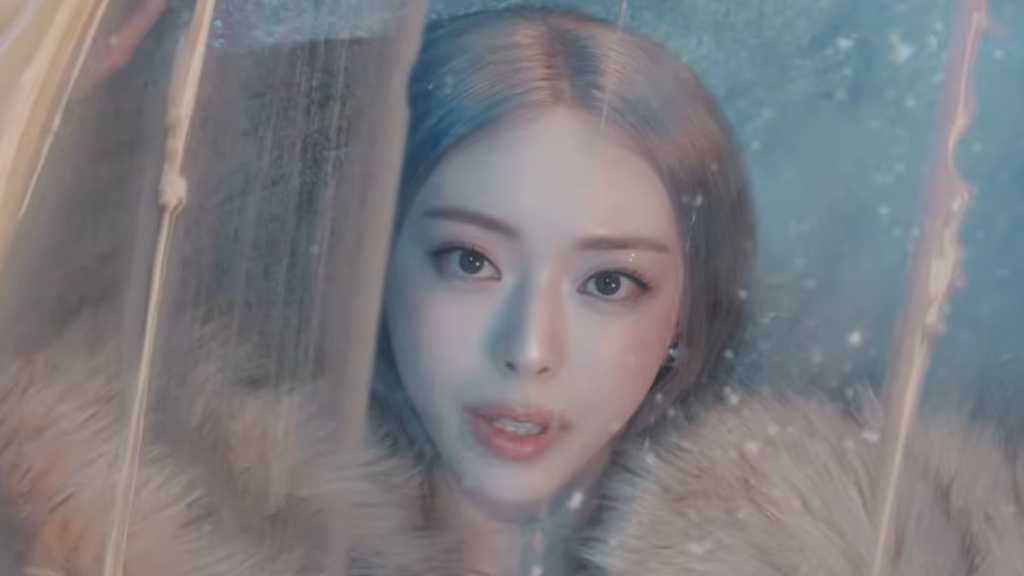 Yuna from ITZY releases her solo debut album 'Ice Cream' with a captivating music video, showcasing her charm and talent.