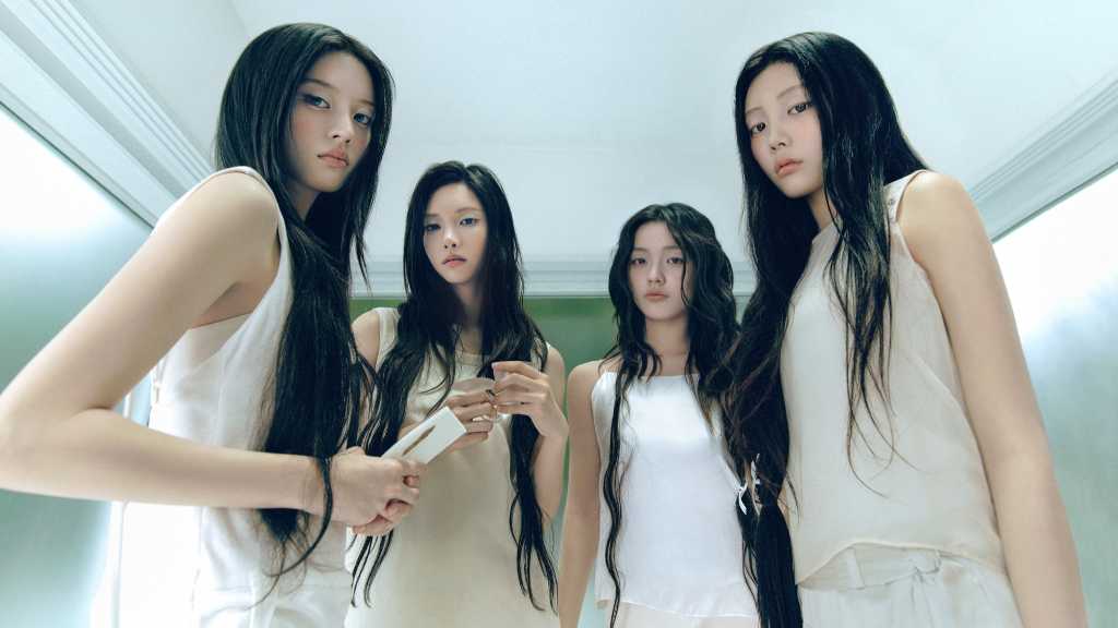 ILLIT revealed a “QUIET” concept photo and film for its 5th mini album, showing cold emotions after heartbreak and building comeback buzz.