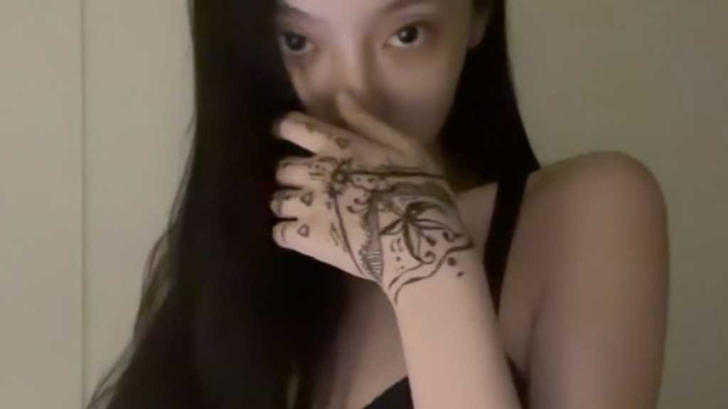aespa's NINGNING shares her tattoo art on Instagram, showcasing unique designs on her hand and her artistic process in a video.