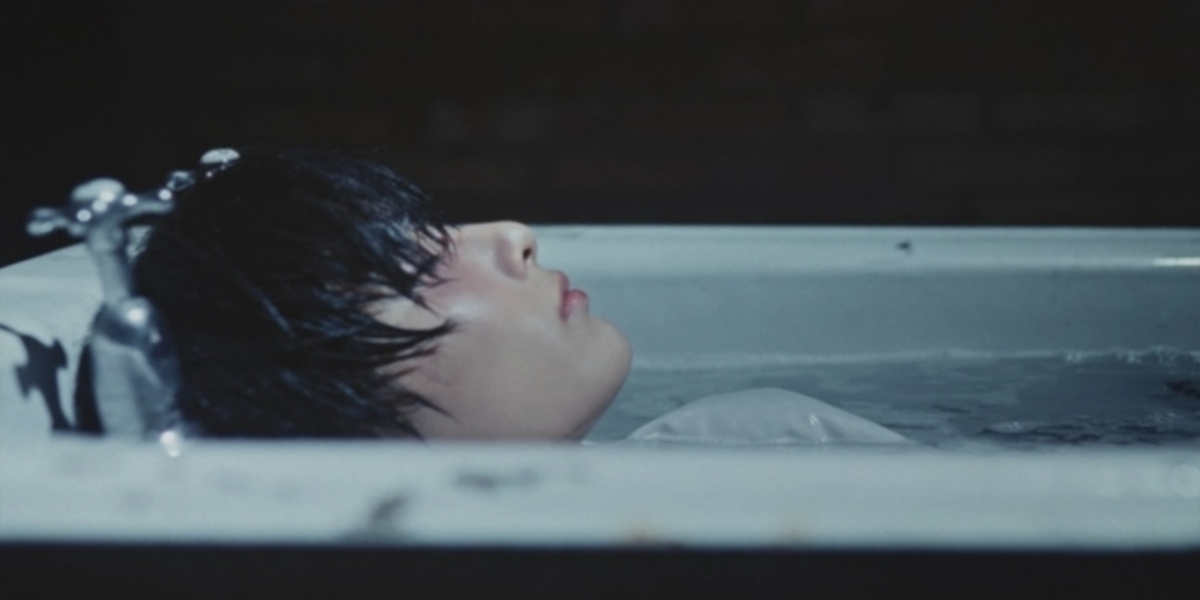 Stray Kids' I.N captivates fans in solo teaser for new album 'HOP', showcasing emotional depth and unique charm ahead of its release.