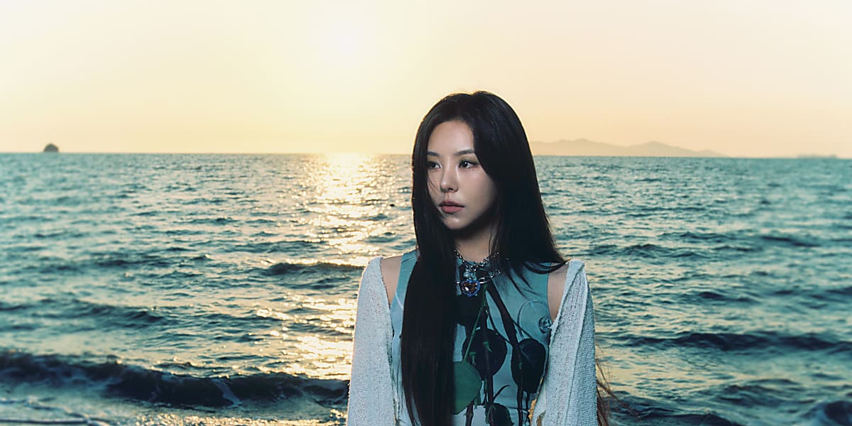 Fiin of MAMAMOO is back with new song "coco water" featuring summer vibes in concept photos released by THE L1VE agency.