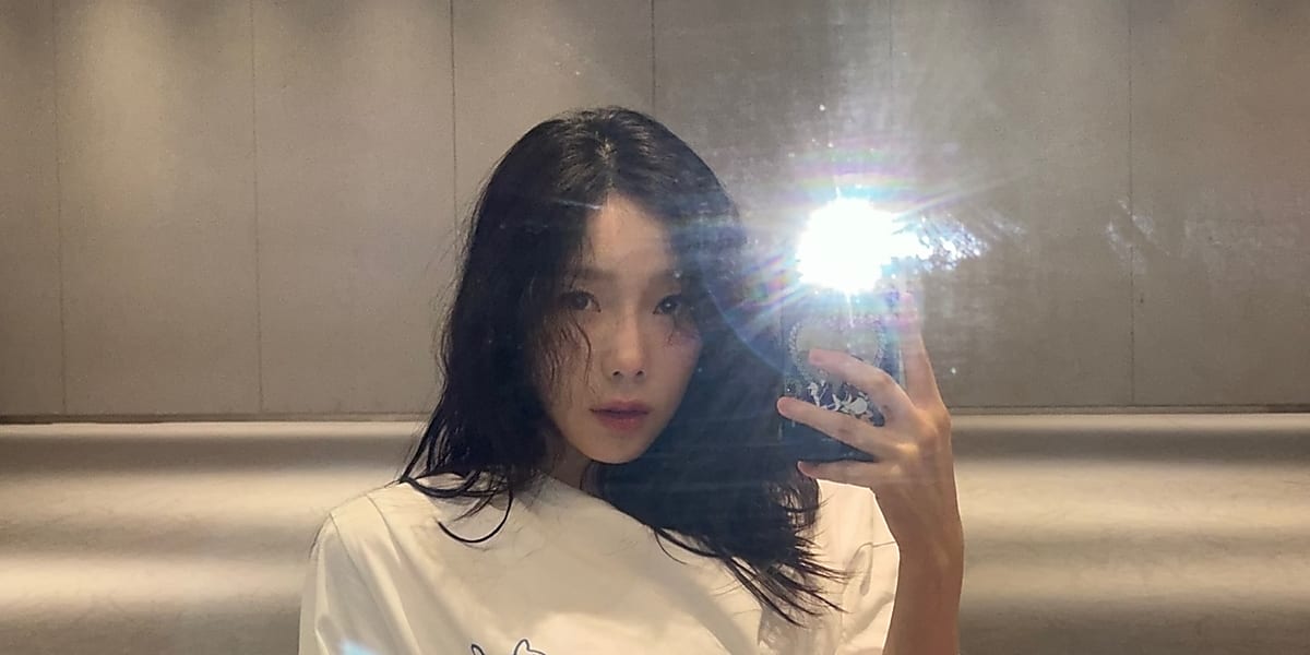 Taeyeon stuns with beauty in mirror selfie on Instagram, fans excited for future activities.