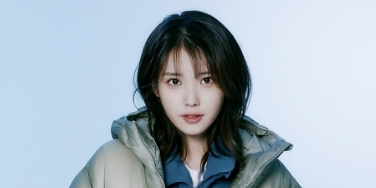 IU reveals winter looks for BLACK YAK, featuring lightweight down jackets and outdoor styles in a new photoshoot.