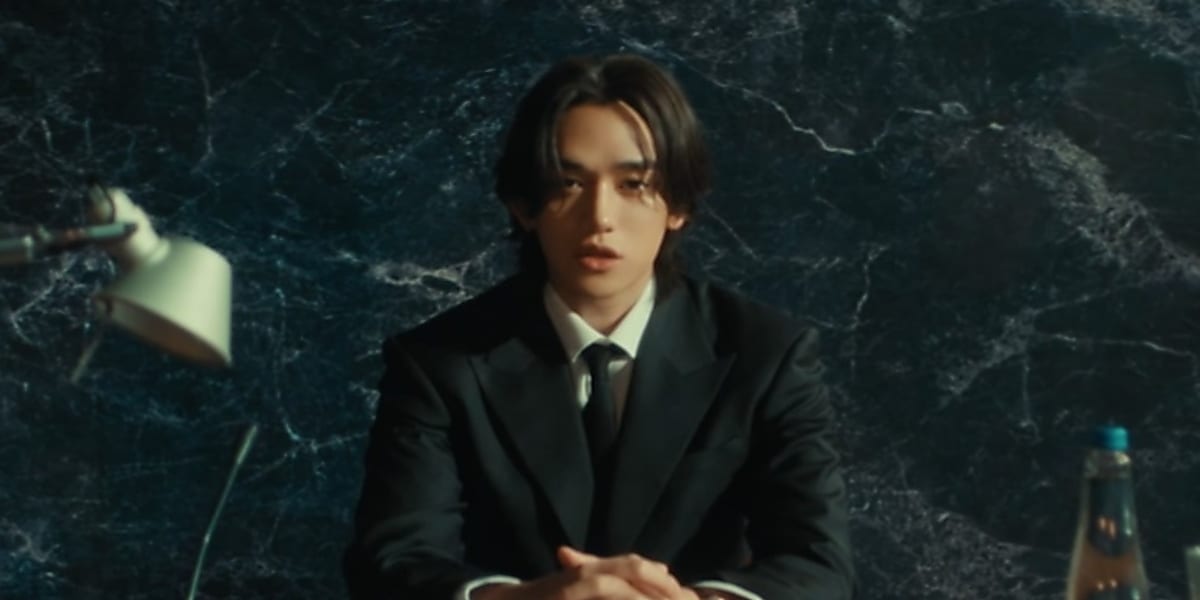 NCT's Lucas debuts solo with "Renegade," a rock-based hip-hop track expressing determination to walk one's own path.