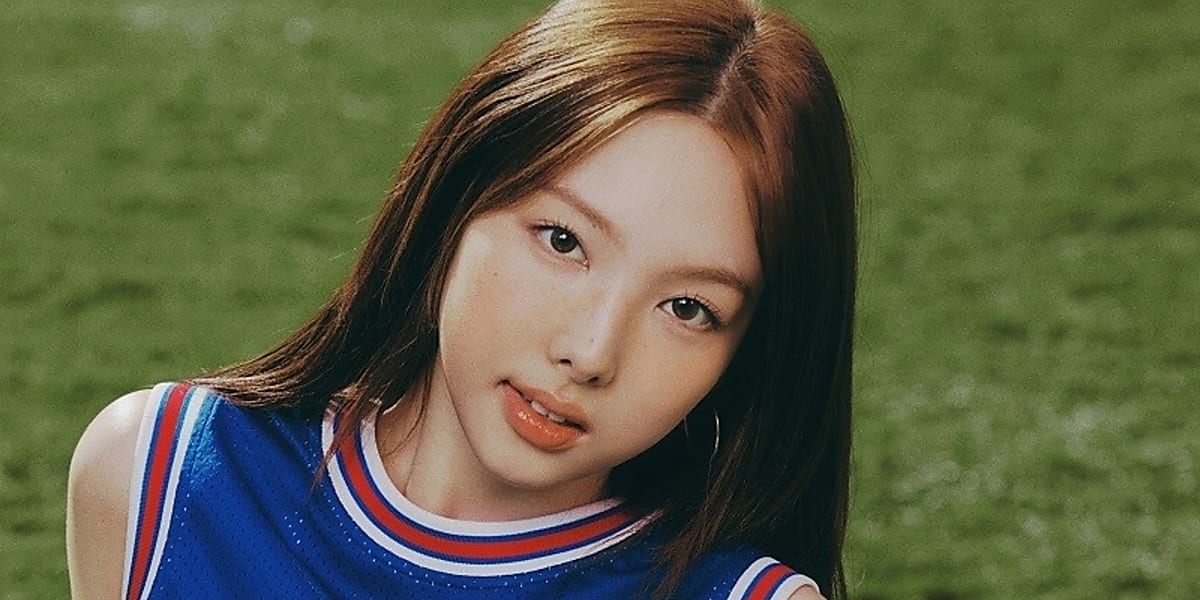 Nayeon of TWICE models Tommy Hilfiger's latest "International Games" collection, evoking a sporty preppy look for campus life.