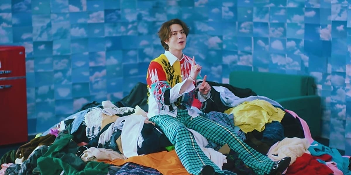 GOT7's Yugyeom releases 1st solo album "TRUST ME" with title track "1 MINUTE" music video, showcasing unique sensibility.