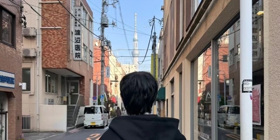 EXO's Chanyeol shares photos in Japan, attracting attention. Fans react positively to his Instagram post.