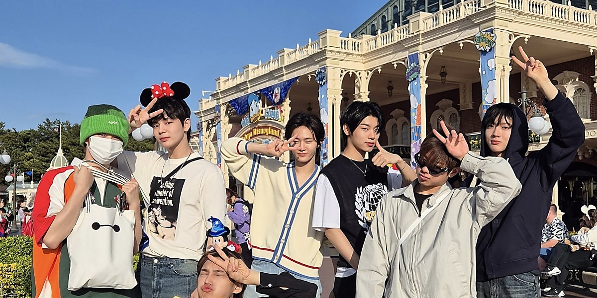 EVNNE members enjoy first Disneyland visit in Tokyo, share fun moments on social media, continue Asian tour with upcoming concerts.