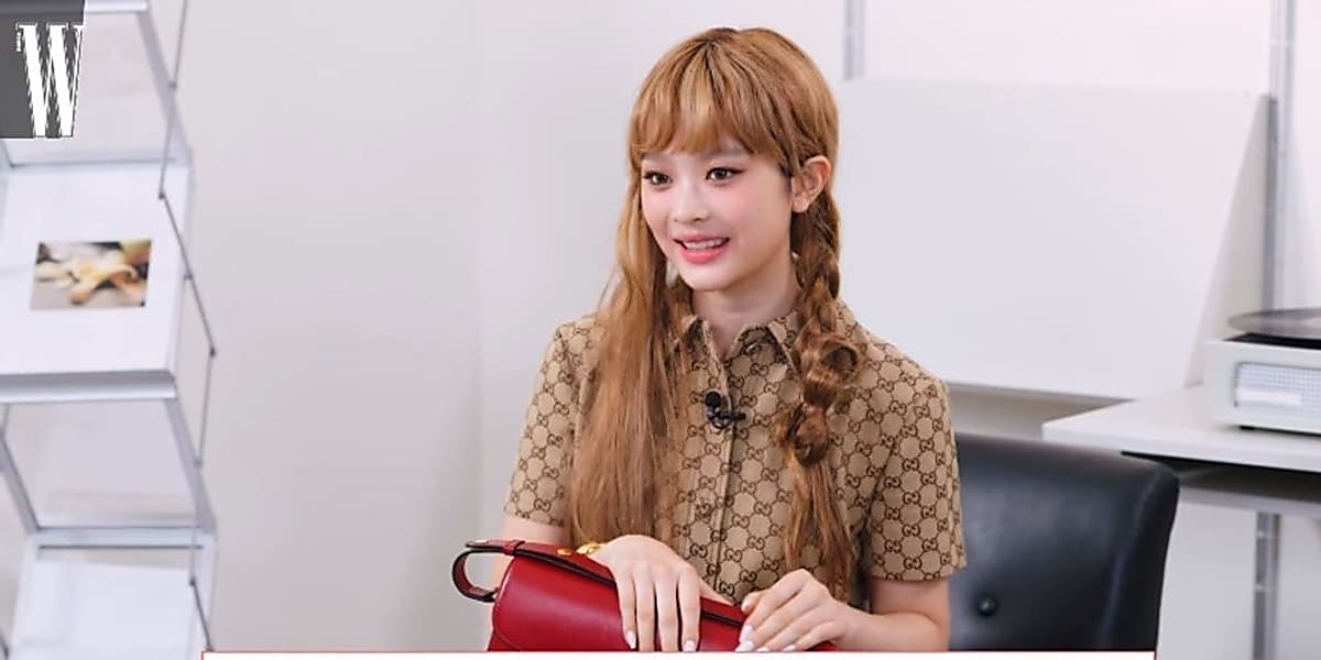 W KOREA YouTube video showcases NewJeans' Hani sharing special items with sentimental value, from a bag to a mood light.