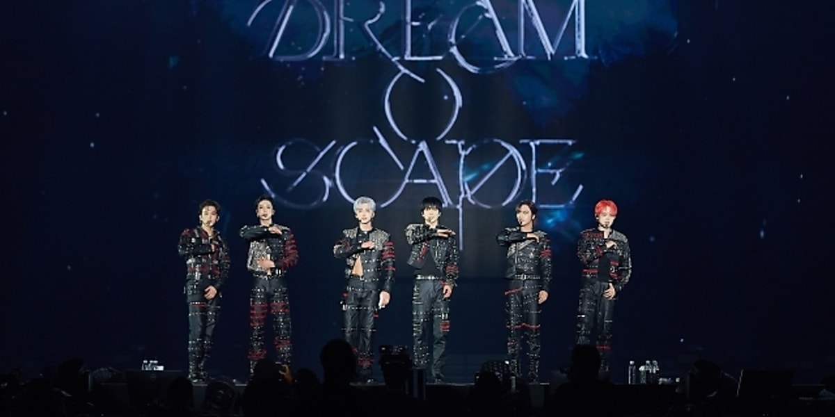 NCT members surprise fans at DREAM concert with special appearance, exciting the audience with their support.